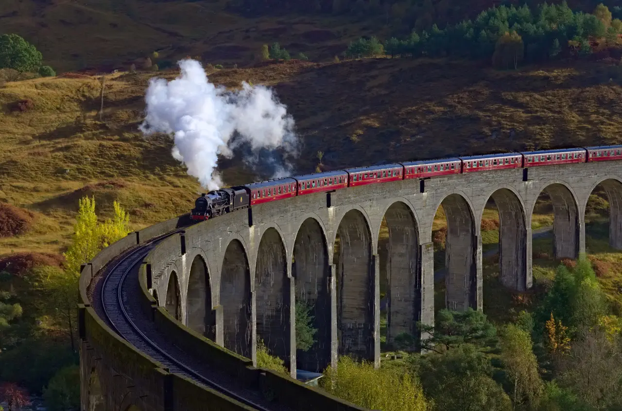 The Jacobite steam train crossing the Glenfinnan Viaduct in the Scottish Highlands